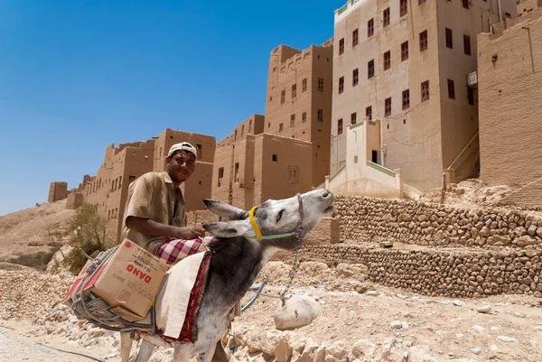 Man Rides His Donkey Front Buildings Made Mud Stone May — Stock Photo, Image