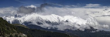Panoramic view of of snowy Mount Olympus, the highest mountain of Greece, home of the ancient Greek gods clipart
