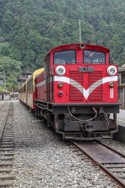 Red train stop in fenchihu train station at alishan mountain,taiwan