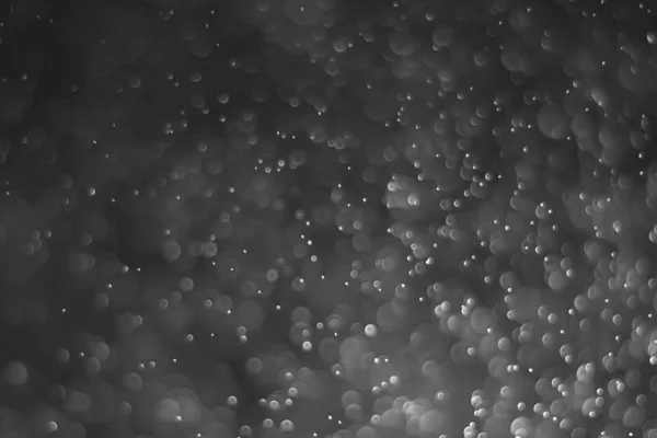 Licht von Bokeh Water Dot Farbe schwarz und weiß für Hintergrund — Stockfoto