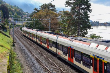 Montreux ,Switzerland-October 23,2019:The train on railway in front of  Lake Geneva in Montreux at switzerland