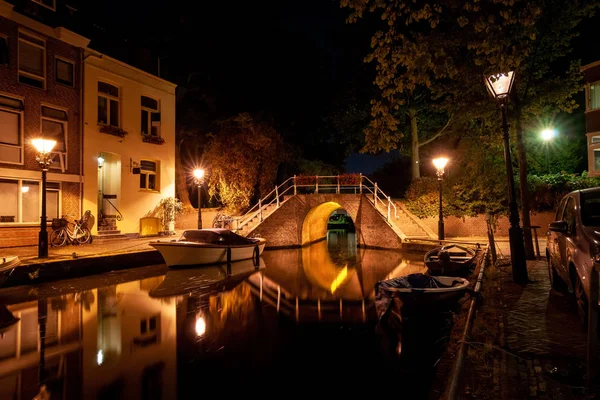 Details of streets, houses, alleys and canals in the old town of Alkmaar in North Holland. Beautifully illuminated city with monuments and locations, photographed in the evening and the night.