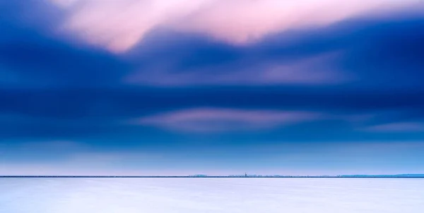 View over smooth lake with drifting clouds above minimalist dutc — Stock Photo, Image
