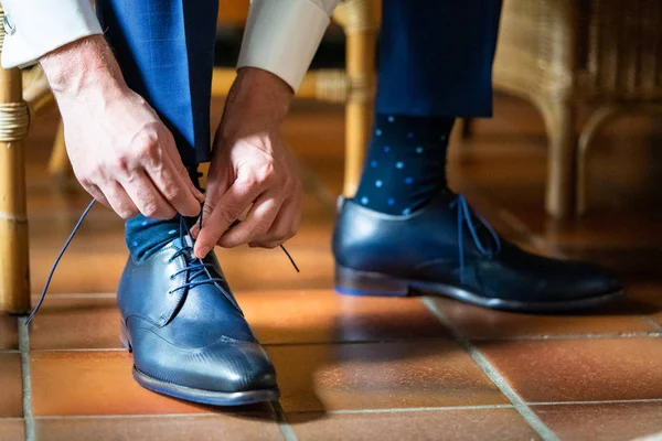 Business man or groom dressing up with classic elegant shoes.