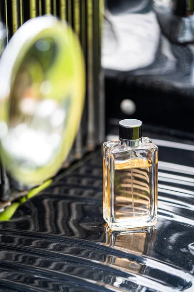 Luxury perfume bottle of the groom on the body of a wedding oldt