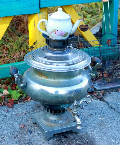 the old samovar is heated on firewood and coal