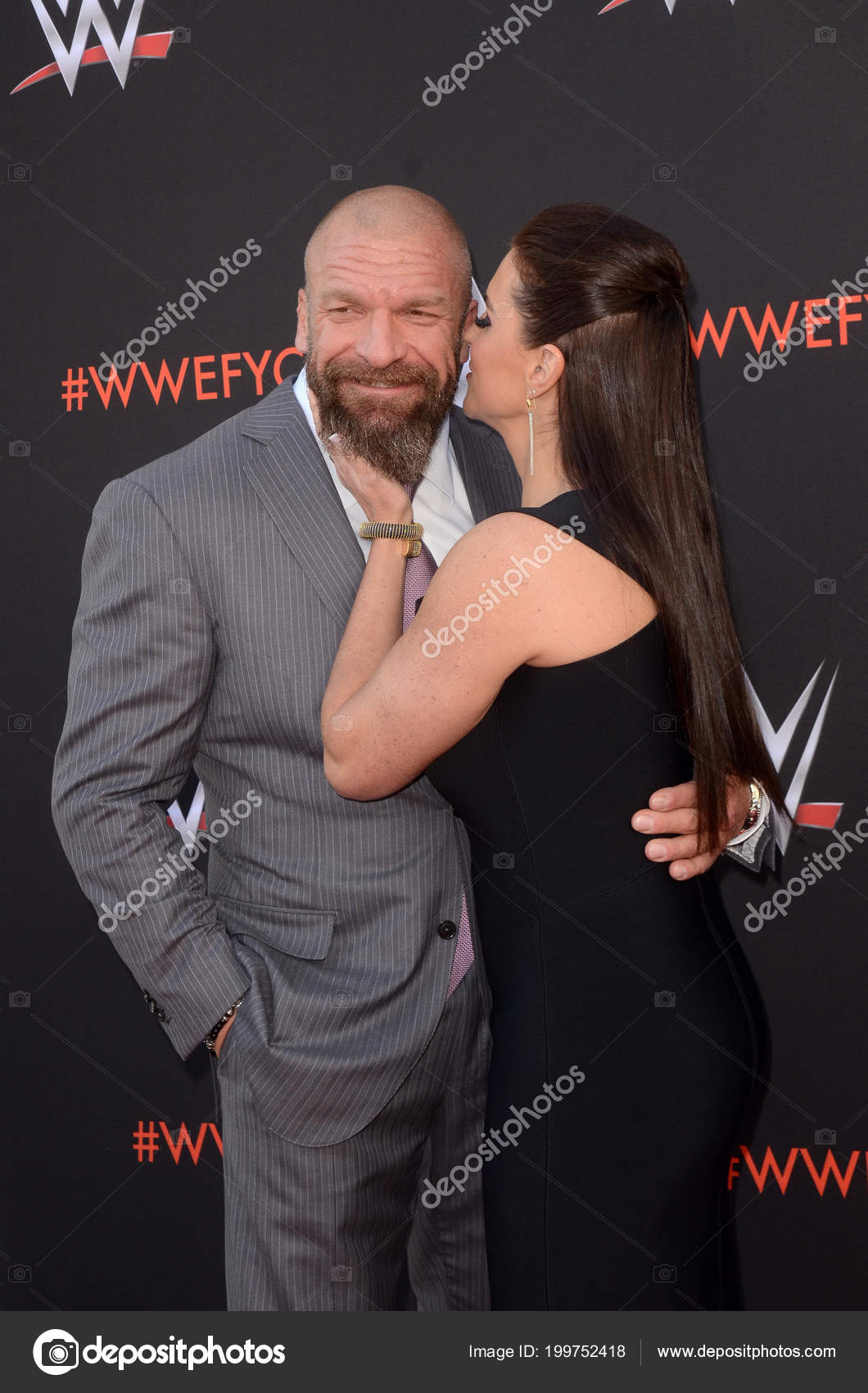 Triple H And Stephanie Mcmahon Kissing