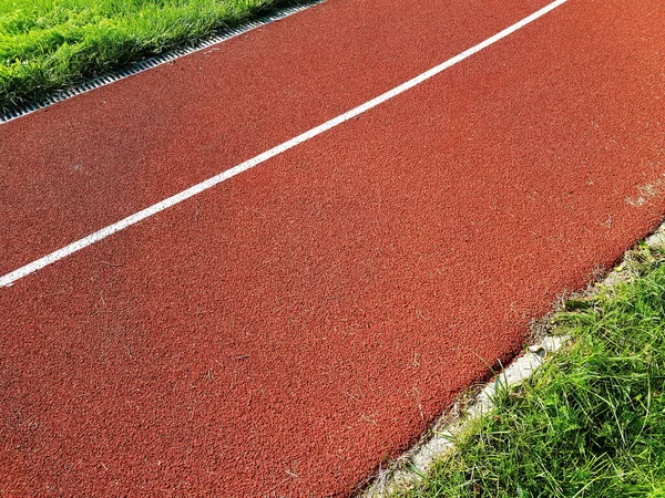 Cinta Correr Roja Con Líneas Blancas Estadio Deportivo Pistas Rojas — Foto de Stock