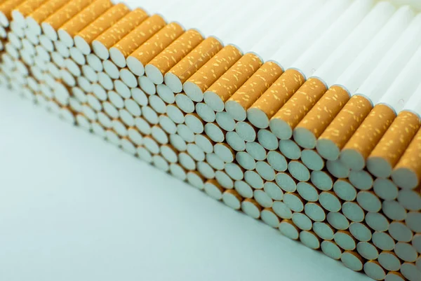 Multiple White Cigarettes Tubes Yellow Filters Row Isolated — Stock Photo, Image