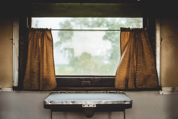 Old style window in the passenger car. Ukrainian railways train