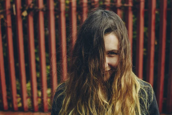 Joyful Smiling Girl Her Beautiful Long Hair Tousled Covering Her — Stock Photo, Image