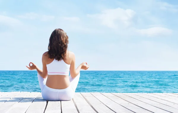 Woman White Sporty Clothes Meditating Wooden Pier Summer Sea Sky — Stock Photo, Image