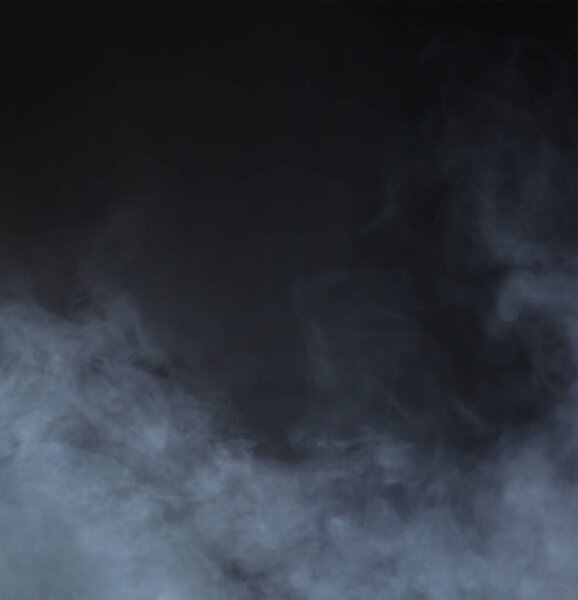 Grey smoke over black background. Abstract background.