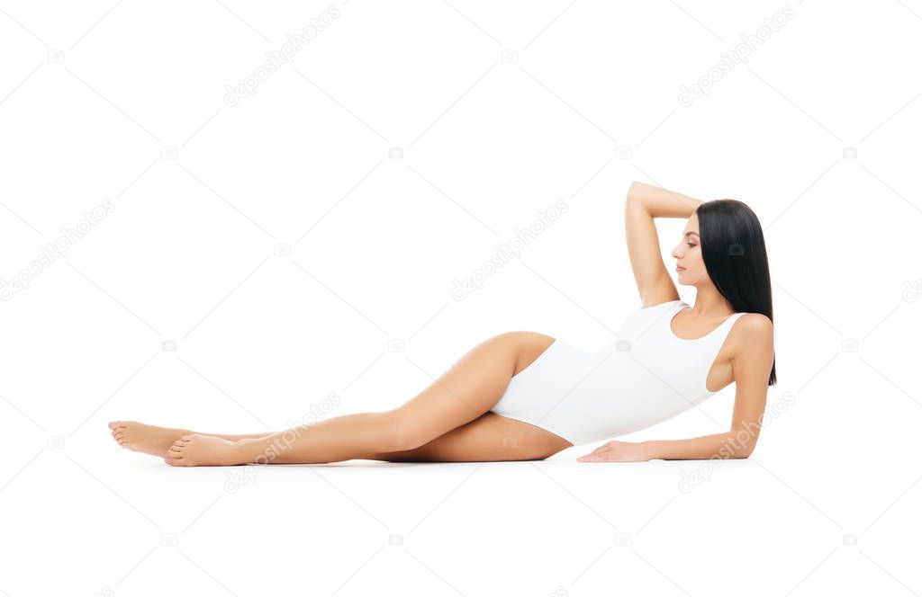 Fit and sporty girl in underwear. Beautiful and healthy woman posing over white background. Sport, fitness, diet, weight loss and healthcare concept.