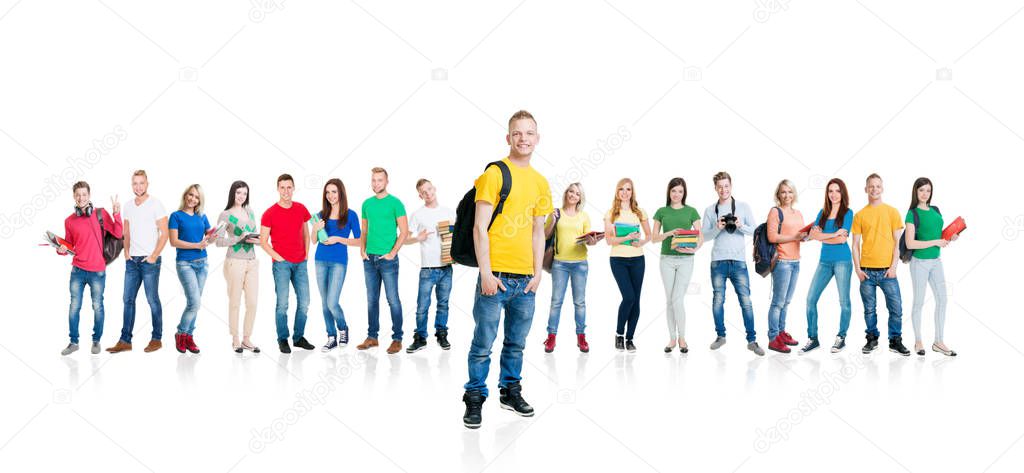 Large group of smiling friends staying together and looking at camera isolated on white background. Friendship and education concept.