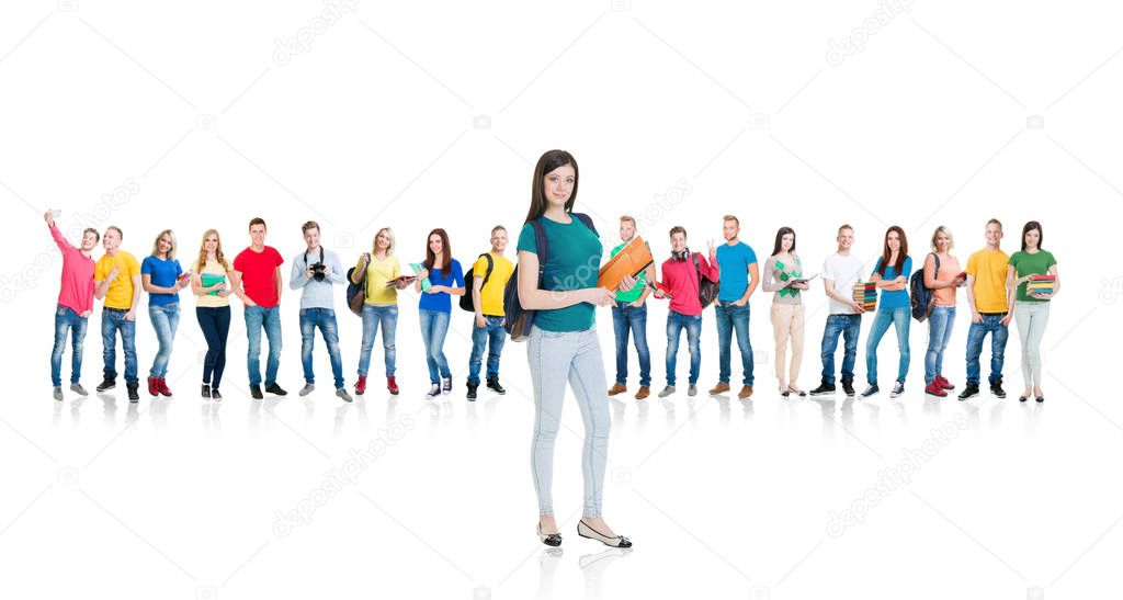 Large group of smiling friends staying together and looking at camera isolated on white background. Friendship and education concept.