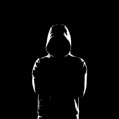 Portrait of computer hacker in hoodie. Obscured dark face. Data thief, internet fraud, darknet and cyber security concept.