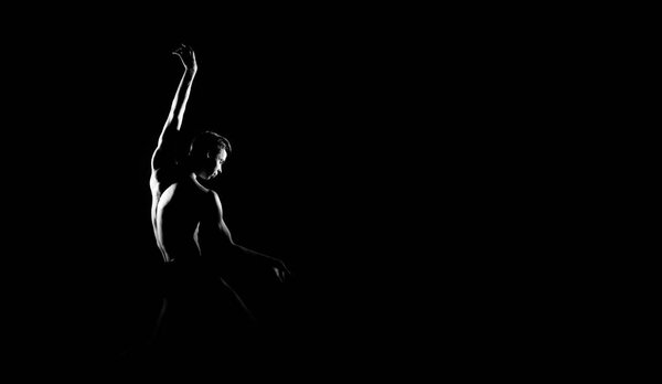 Black and white silhouette trace of male ballet dancer. Long monochrom horizontal image.