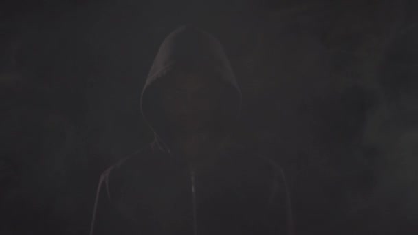 Portrait of computer hacker in hoodie. Obscured dark face. Data thief, internet fraud, darknet and cyber security . — Stock Video