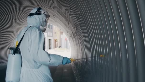 Man Protective Suit Disinfects Subway Tunnel Antiseptic Sprayer Surface Treatment — Stock Video