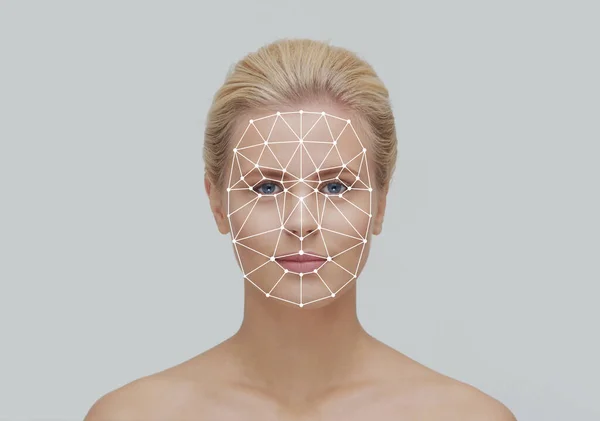 Face of a beautiful girl with a scanning grid on her face. Face id, security, facial recognition, authentication technology concept.