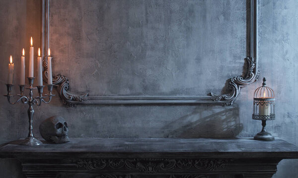 Mystical Halloween still-life background. Skull, candlestick with candles, old fireplace. Horror and witchery concepts.