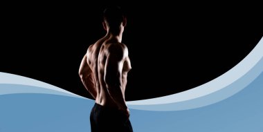 Strong, fit and sporty bodybuilder man over black background. Sport and fitness concept. clipart