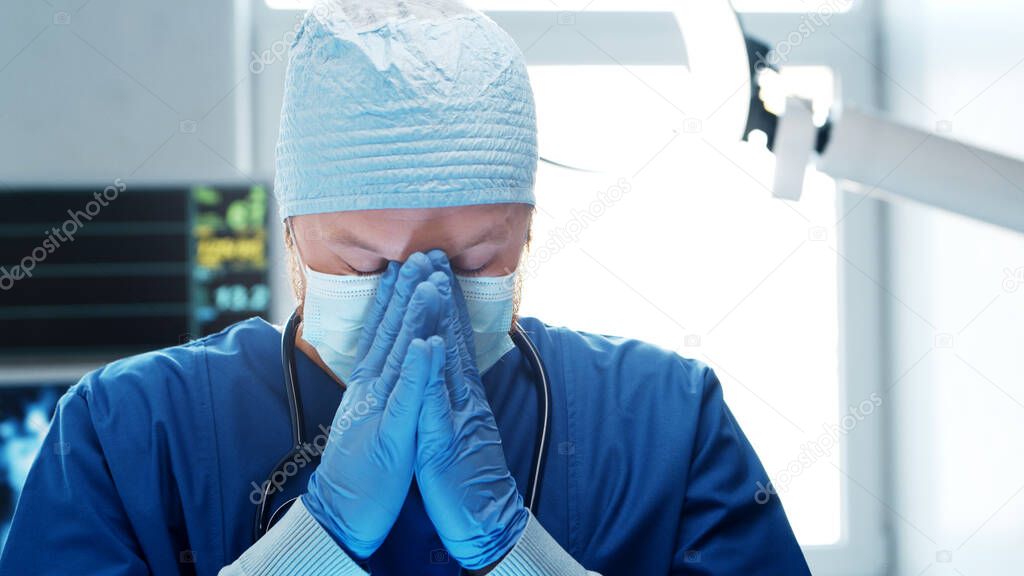 Professional medical doctor working in emergency medicine. Portrait of the surgeon in protective mask. Medical concept.