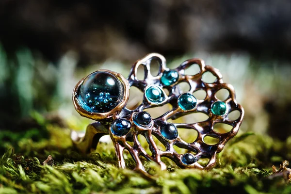 Beautiful ring with nature ornament on natural background — Stock Photo, Image