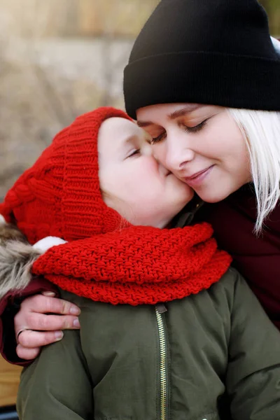 Cute Little Preschool Daughter Kissing Young Beautiful Smiling Mother Close — Stock Photo, Image