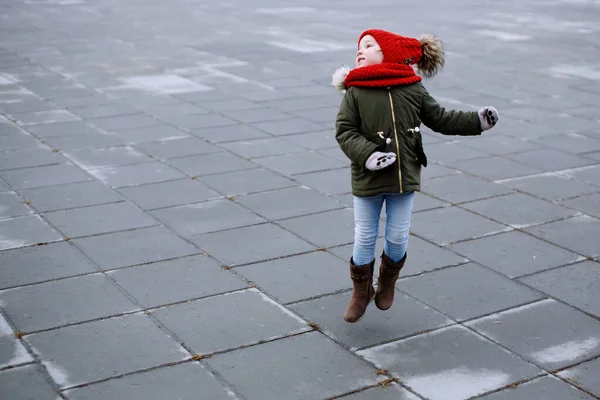 Cute Little Kid Girl Warm Outerwear Having Fun Street Jumping — Stock Photo, Image