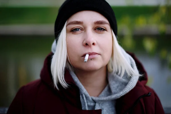 Young Hipster Millennial Woman Lip Piercing Smoking Cigarette Outdoors Looking — Stock Photo, Image