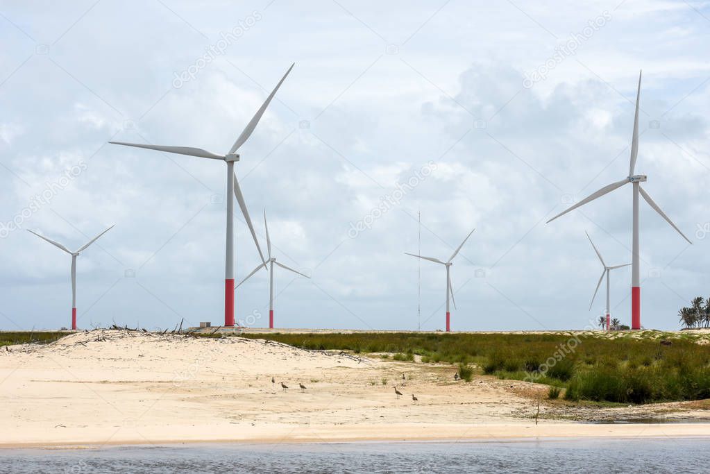 Windmills on the sand dunes of Lencois Maranhenses near Atins on Brazil