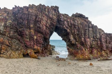 The natural arch on the beach of Jericoacoara, Brazil clipart