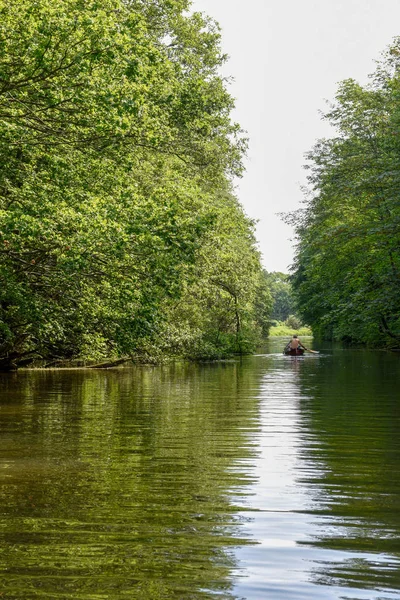 People rowing in a canoe on the river at Vestbirk, Denmark — Stock Photo, Image