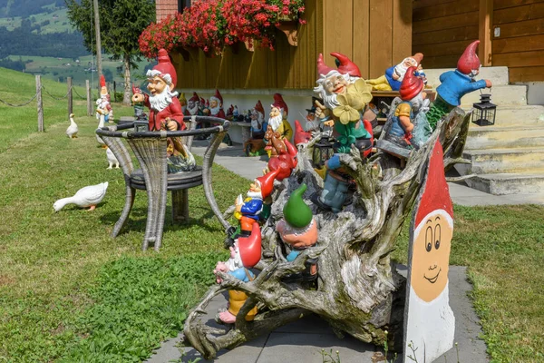 Garden gnomes in a garden of a house — Stock Photo, Image
