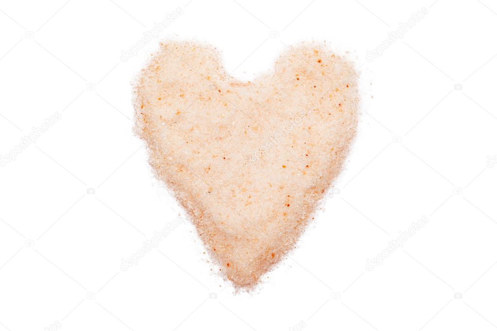 Himalayan salt, heart-shaped, isolated, close up, macro, top view. Flavor food spice pinkish tint. Used for natural digestive aid, air purifier and sleep inducer