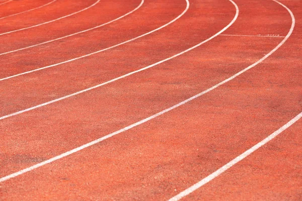 Stadium track for running and athletics competitions. New synthetic rubber treadmill. Empty racetrack.