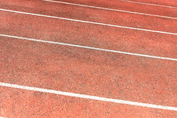 Stadium track for running and athletics competitions. New synthetic rubber treadmill. Empty racetrack.