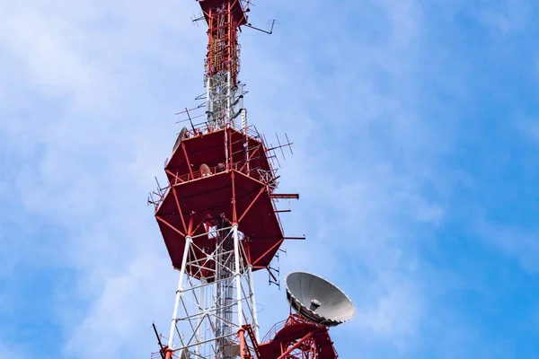 4G TV radio tower with parabolic antenna and satellite dish. Bro