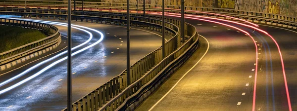 Road car light streaks. Night light painting stripes. Long expos