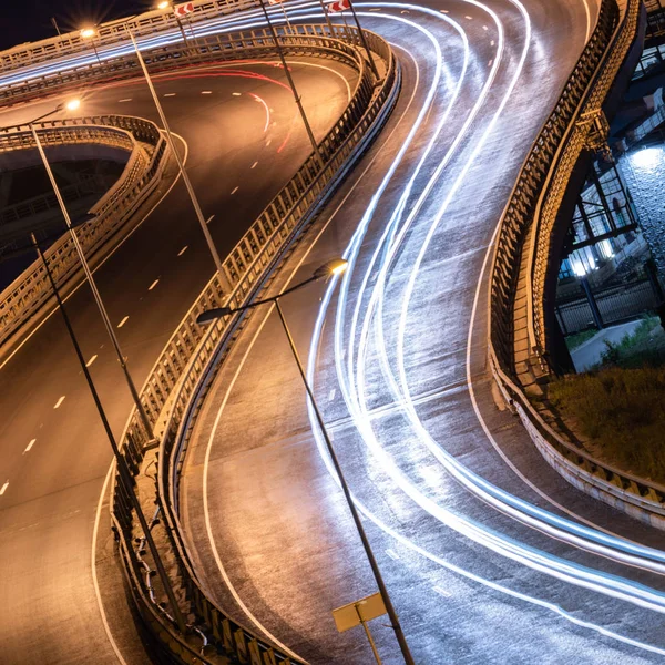 Road car light streaks. Night light painting stripes. Long expos