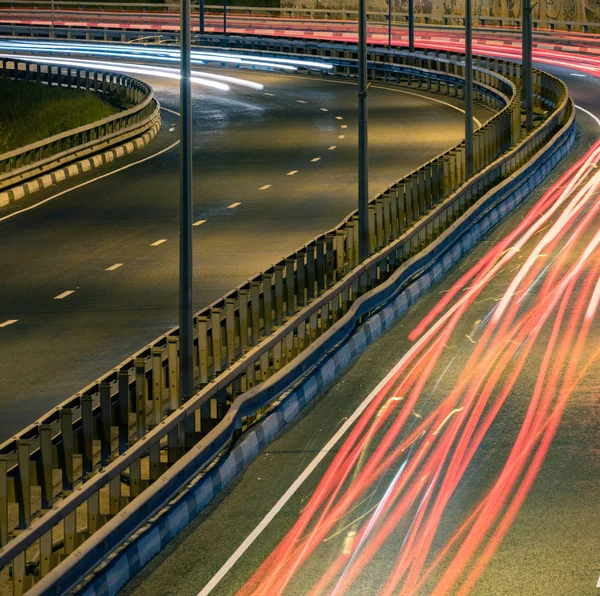 Road car light streaks. Night light painting stripes. Long expos