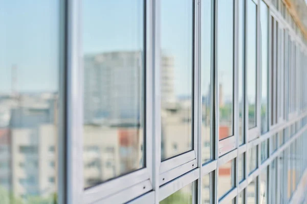 PVC windows on facade of skyscraper. Plastic double glazed windows. Building exterior.