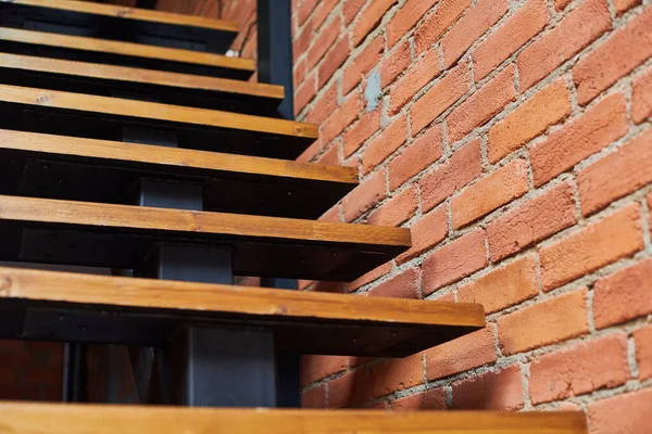 Stairs in loft apartment. Staircase without railing. Modern hipster style attic loft apartment details.