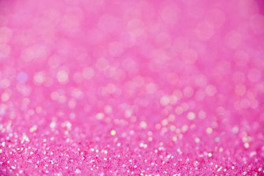 Pembe parıltı dokusu. Yeni yıl ya da tebrik kartı için yeni yıl arkaplanı. Sevgililer Günü kutlaması. Şenlik dekorasyonu için parlak bir tasarım: düğün, bayram veya yıldönümü partisi.