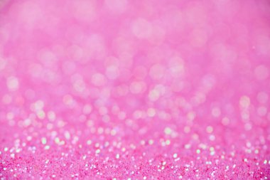 Pembe parıltı dokusu. Yeni yıl ya da tebrik kartı için yeni yıl arkaplanı. Sevgililer Günü kutlaması. Şenlik dekorasyonu için parlak bir tasarım: düğün, bayram veya yıldönümü partisi.