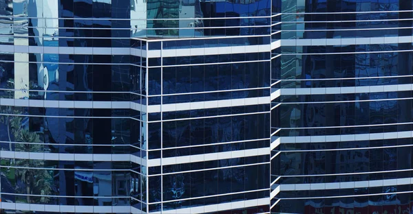 glass wall of a building with a ledge