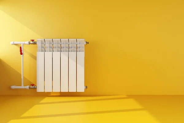 Radiador de aquecimento na parede amarela — Fotografia de Stock