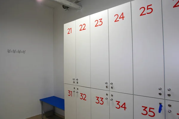 Lockers in the locker room pool and sports club, standing next to the bench.